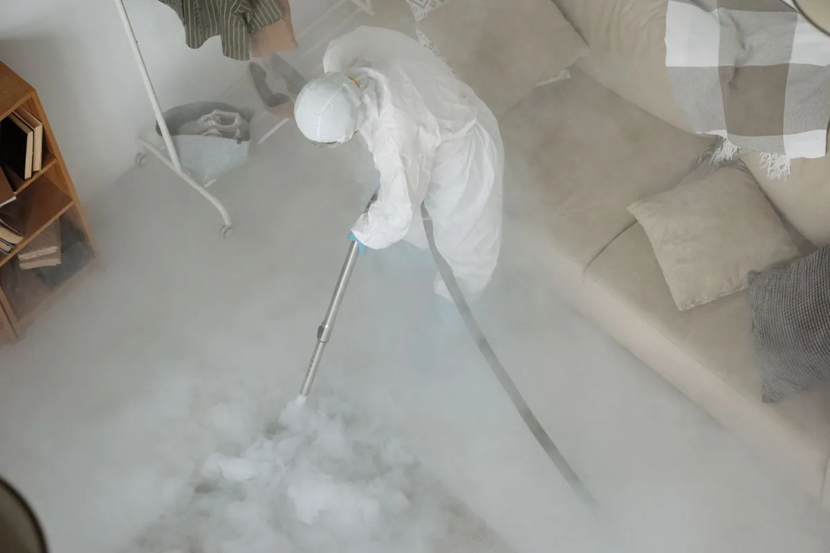 Biohazard cleanup technician in protective equipment, Blytheville, AR